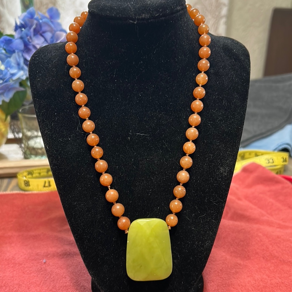 Beautiful stone orange and green necklace hand knotted.